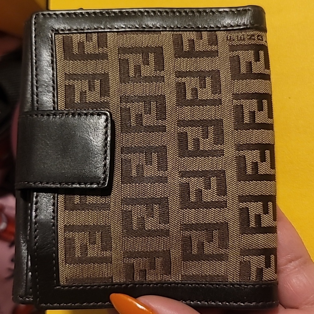 Vintage Fendi Zucca bifold wallet in brown canvas and leather.